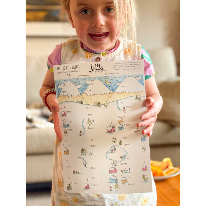 Festive Gift Labels Sheet by Little Difference held by child